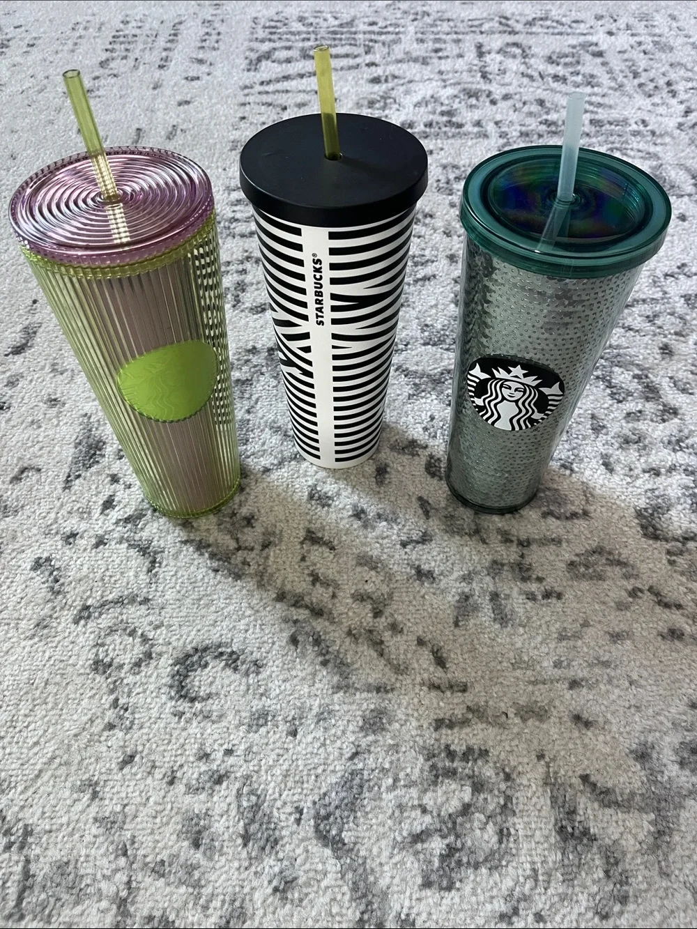Three Starbucks 24 oz venti cold tumblers.